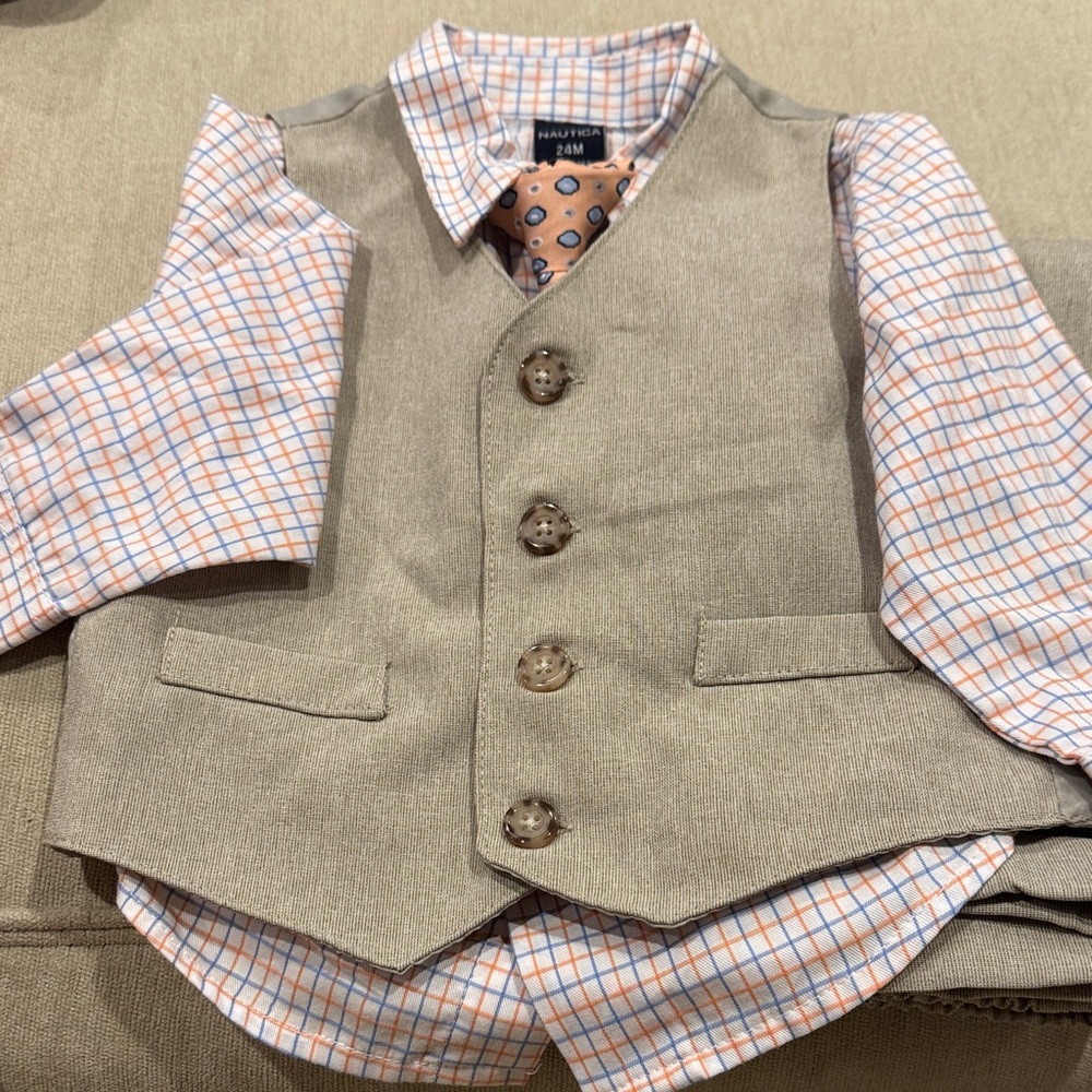 Nautica Tan Vest with Checkered Shirt and Patterned Tie and pants.